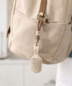 charm llavero cepillo