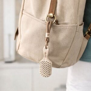 charm llavero cepillo